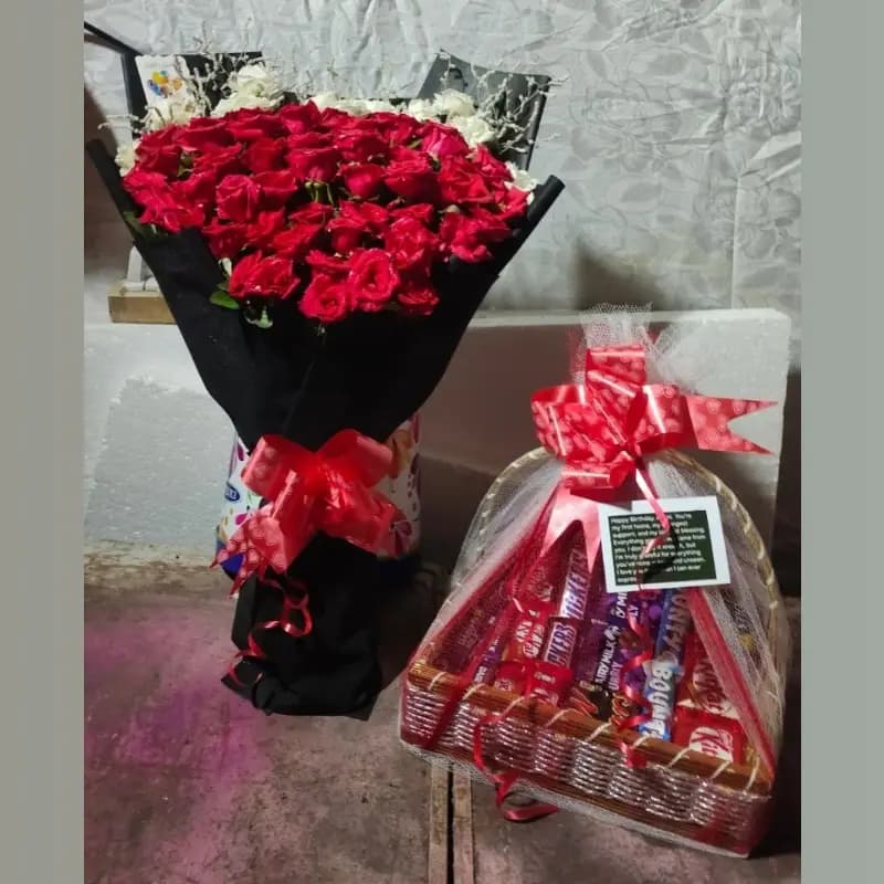 Fresh flowers and chocolate basket