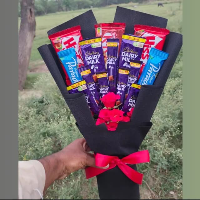 Fresh flowers and chocolate bouquet